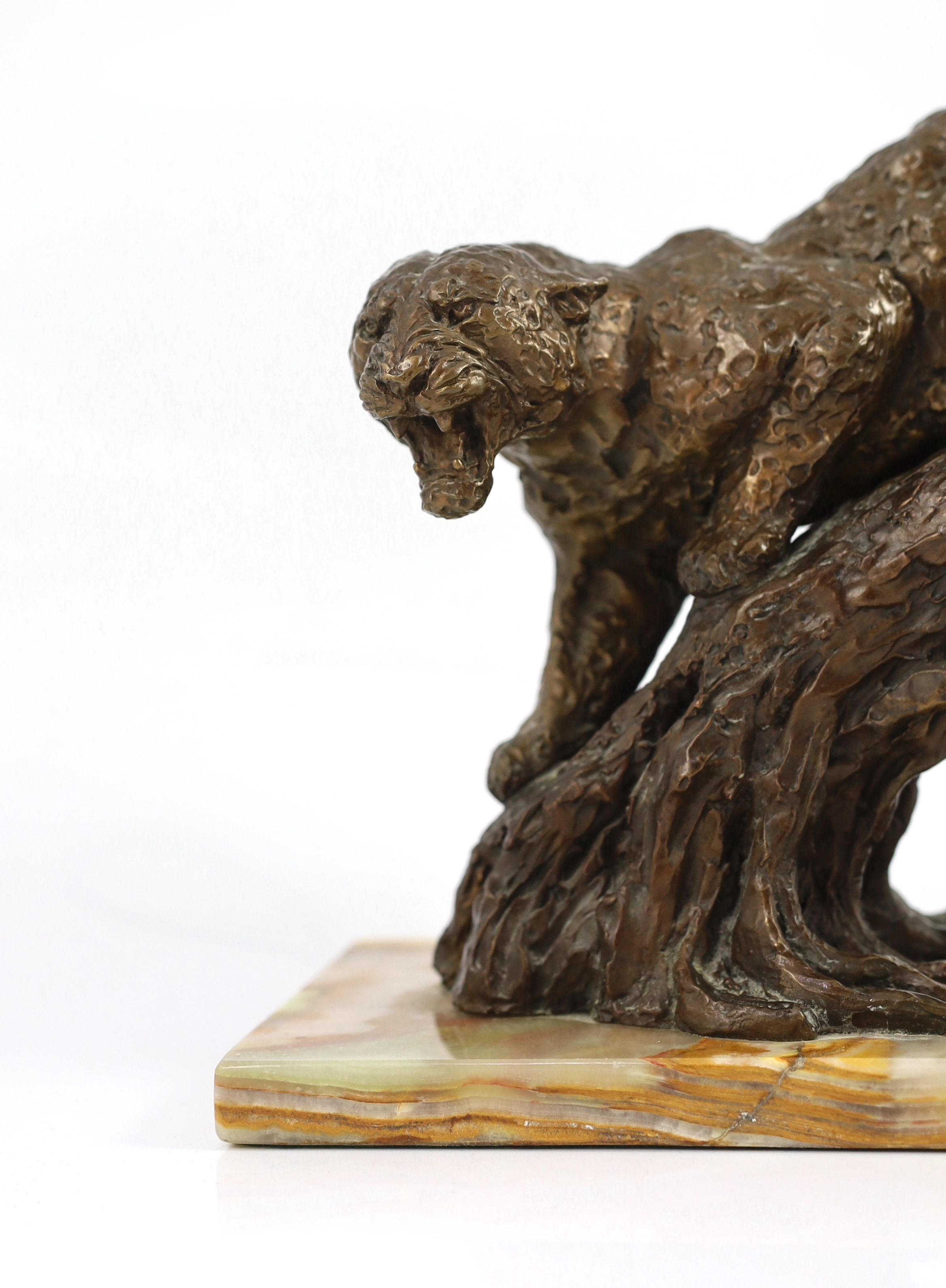 William Timym (British, 1902-1990). A bronze model of a jaguar crouched upon a tree trunk, signed in the bronze with Morris Singer foundry stamp, on green onyx plinth, 34.5cm long, deep 16cm, 25cm high